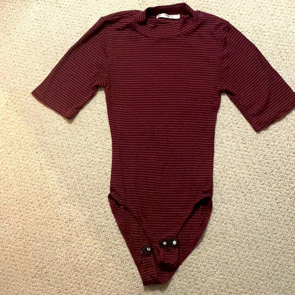 Maroon and blue striped body suit.